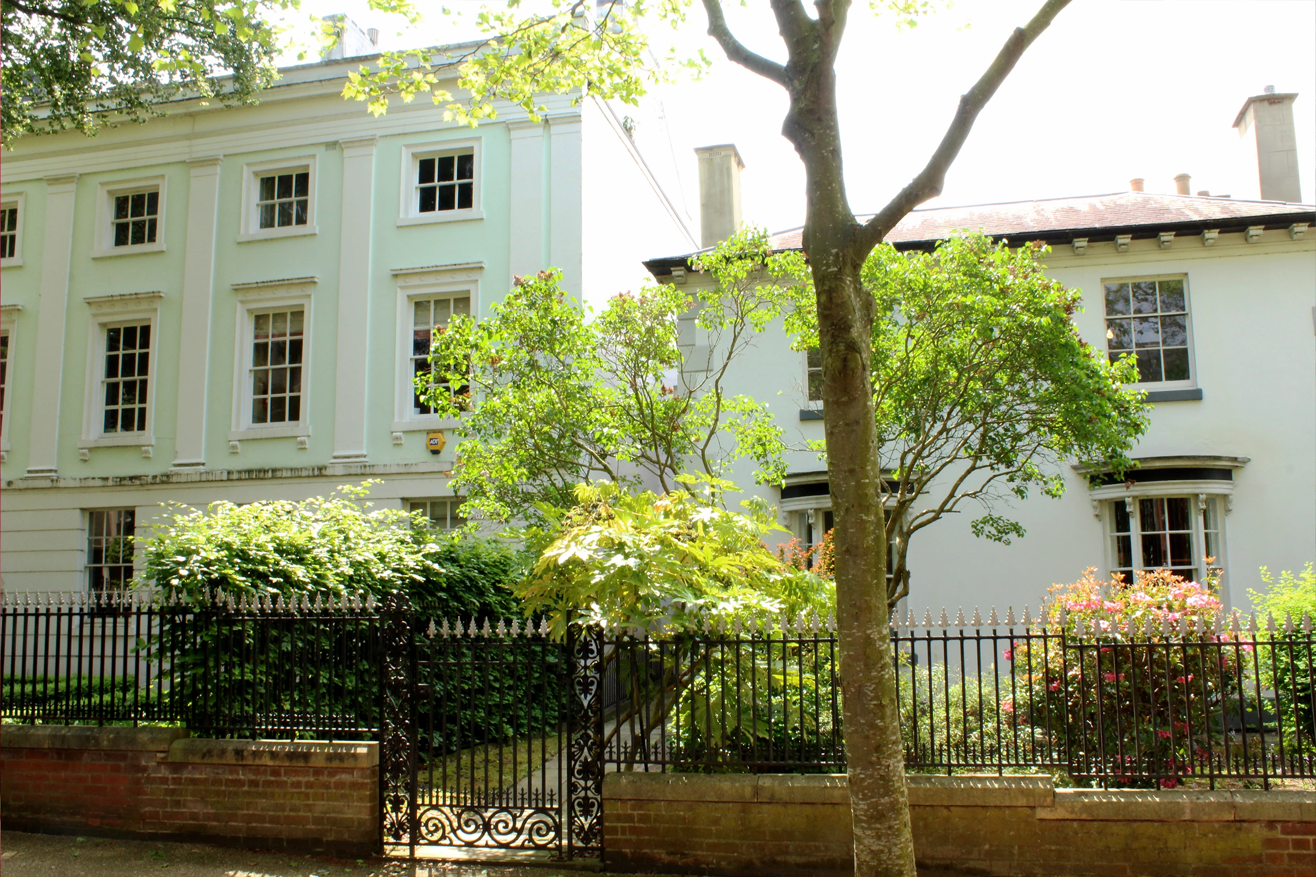 Bulb Studios building with front grate and foliage, from New Walk