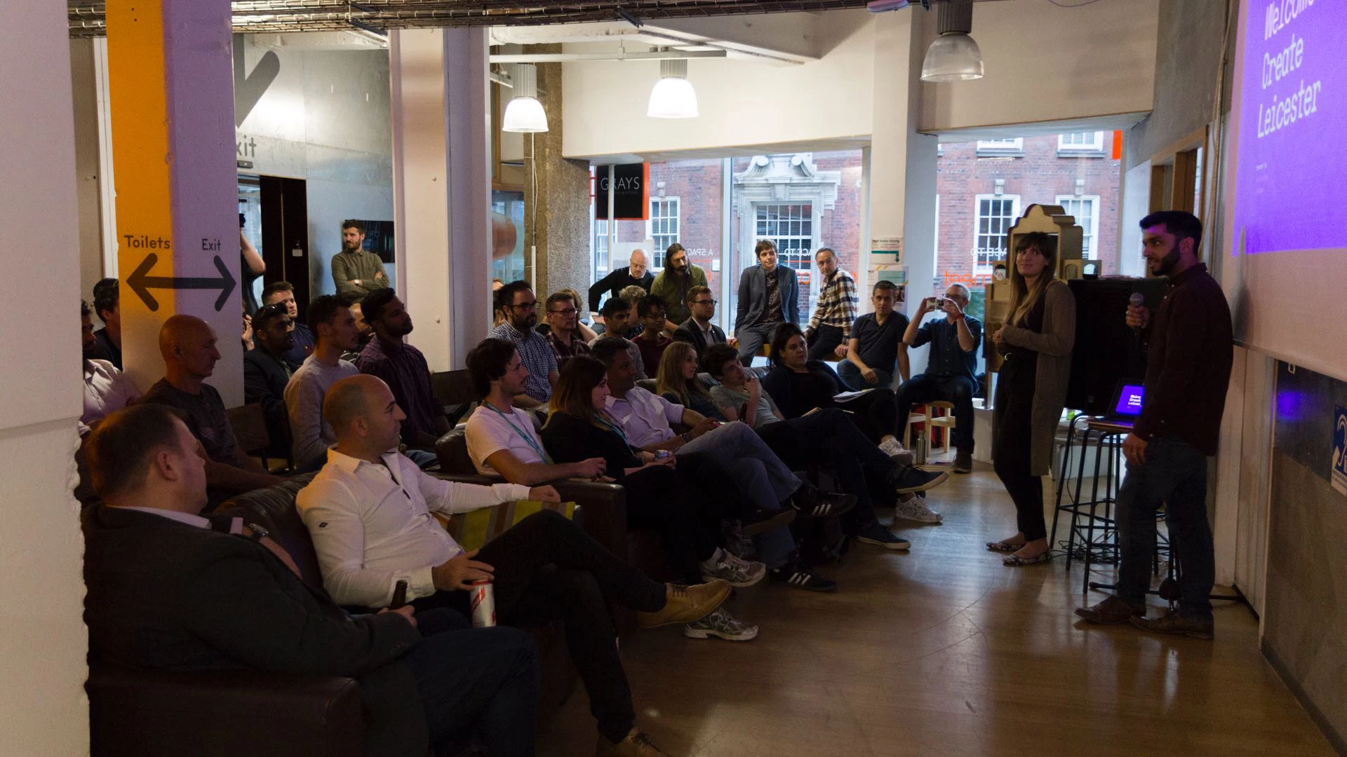 Create Leicester event with crowd looking at speaker