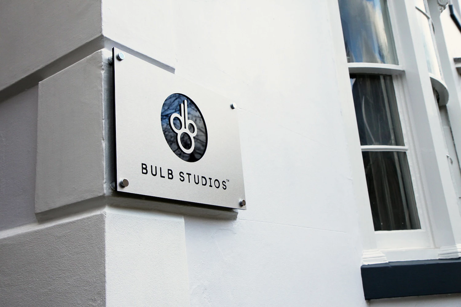 Sign on the wall of the Bulb Studios building with the company's logo